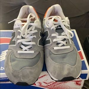 Grey and orange new balance sneakers